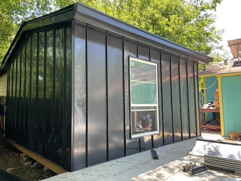 Black standing seam metal wall panels for Roof Inspection in Valley Center